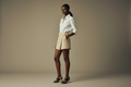 Beige Tweed Skort on White Mannequin with Kitten Heel Mules